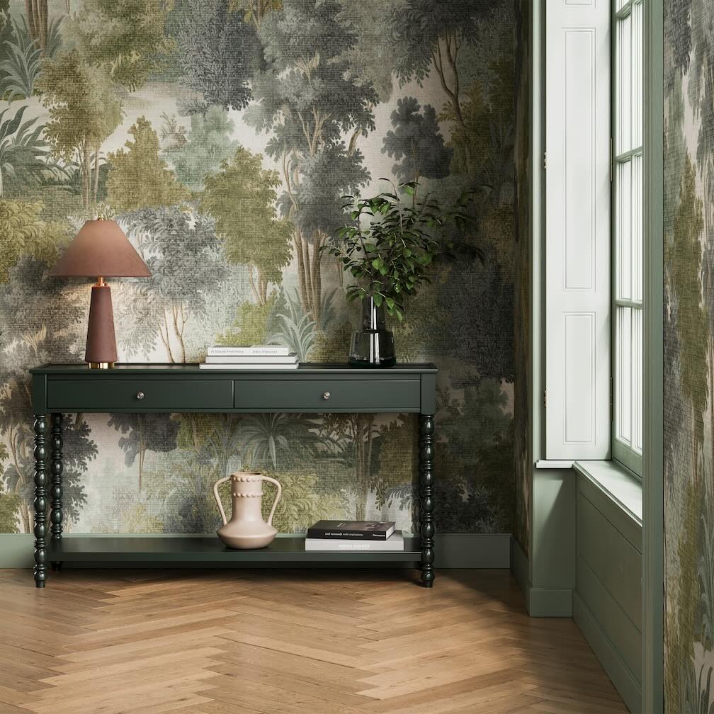 Superfresco Easy Wallpaper Collection - Image of a dining room decorated in a large-scale wallpaper featuring hand-painted trees in rich forest green tones.