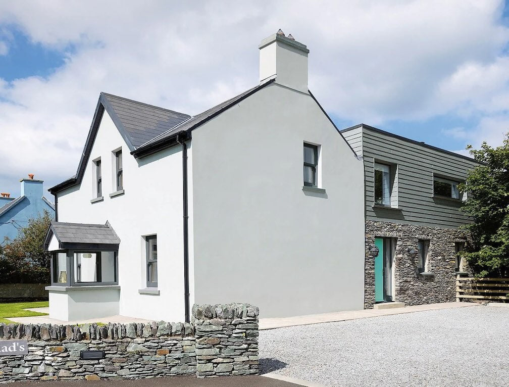 Masonry Paint Collection - Image of a white house and front door freshly painted.